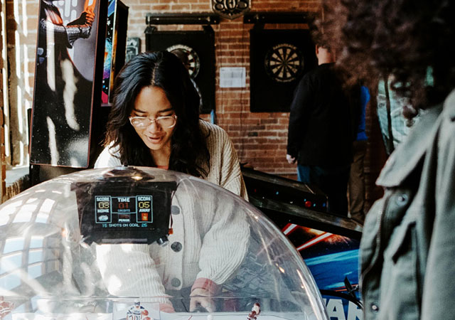 students at an arcade in Downtown Champaign