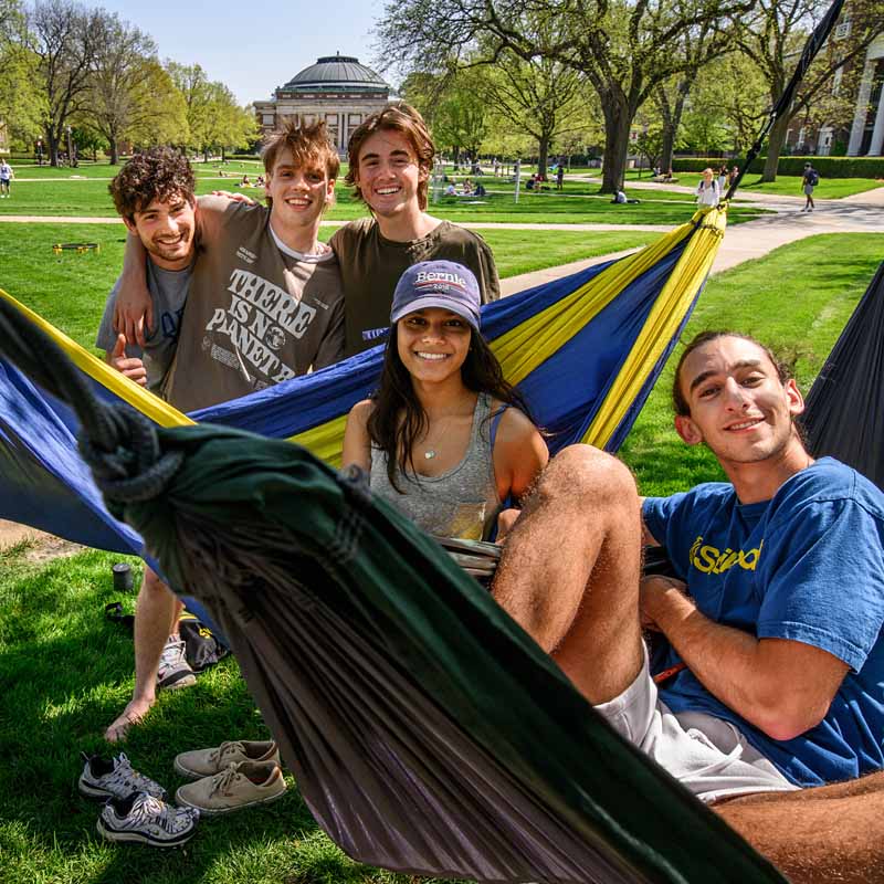 group of friends that loves hammocks hammocking it up on the Quad