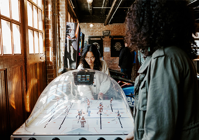 students take a break from the grind at an off-campus arcade
