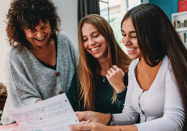 family reviewing their college application options at home