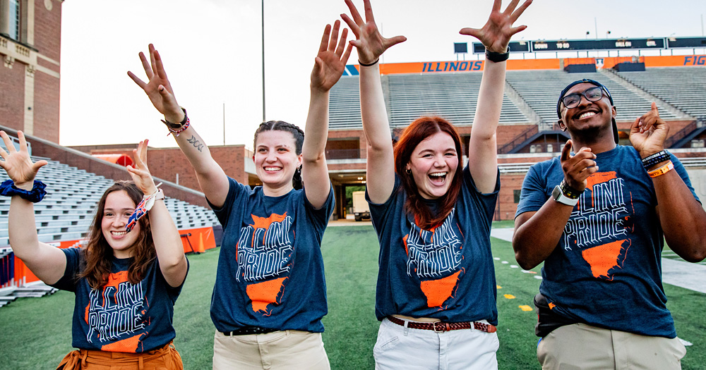 Illini Pride members lead the crowd at Sights & Sounds, a welcome week event at UIUC