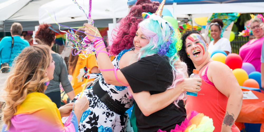 participants hugging at Champaign-Urbana's Pridefest