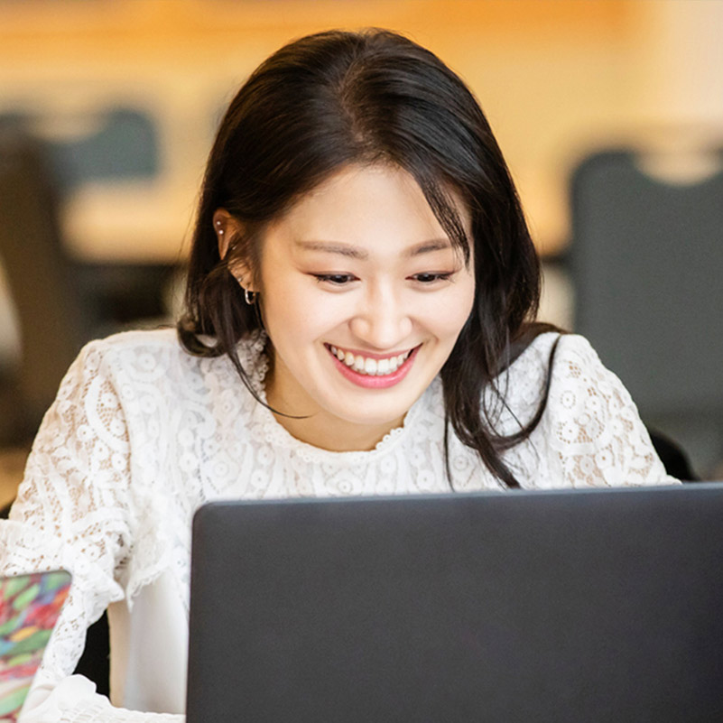 international student using her laptop