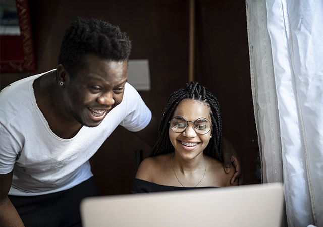 a father and daughter looking at online application resources