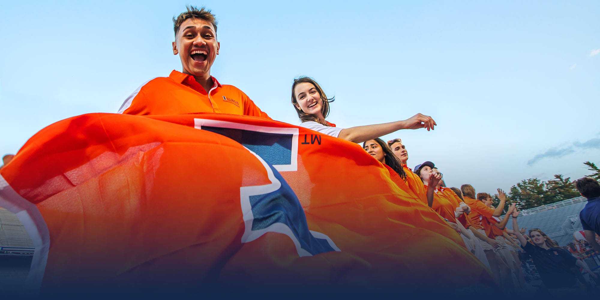 students decked out in orange and blue celebrate the incoming class at the Sights and Sounds Welcoem Week event at Memorial Staidum