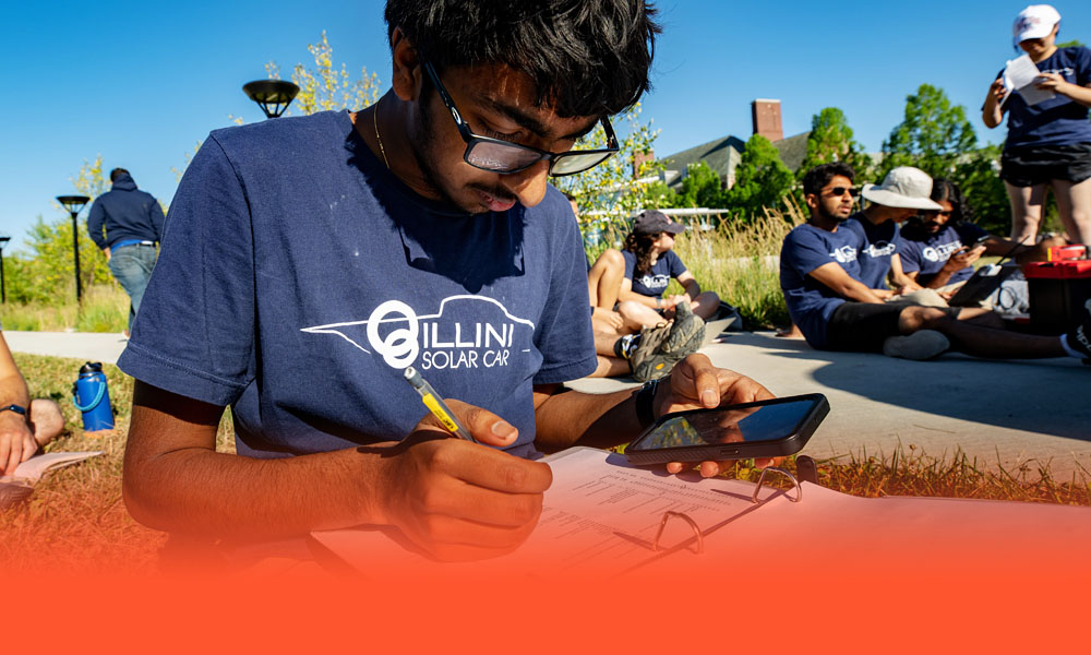 members of the Illini Solar Car team from the University of Illinois Urbana-Champaign prepares for competition in the 2022 American Solar Challenge