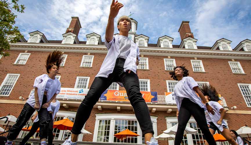 a K-Pop inspired dance group performs for students at the annual Quad Day
