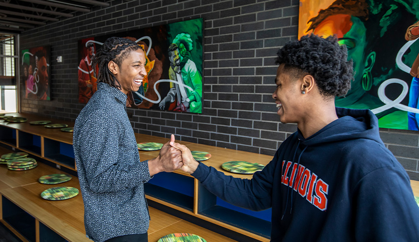 Two friends at Food for the Soul, African American Cultural Center