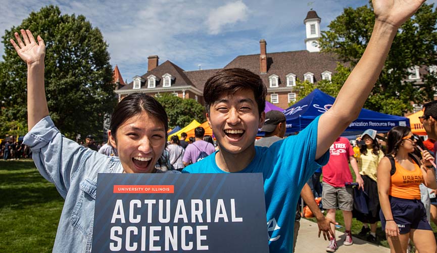 two Actuarial Science students recruiting on the Quad