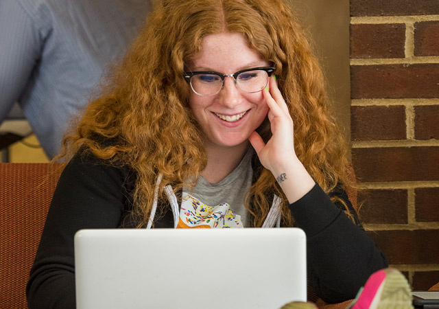 a father and daughter looking at online application resources