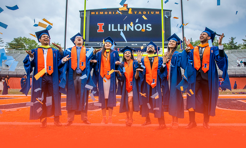 Illinois graduates celebrating at memorial stadium