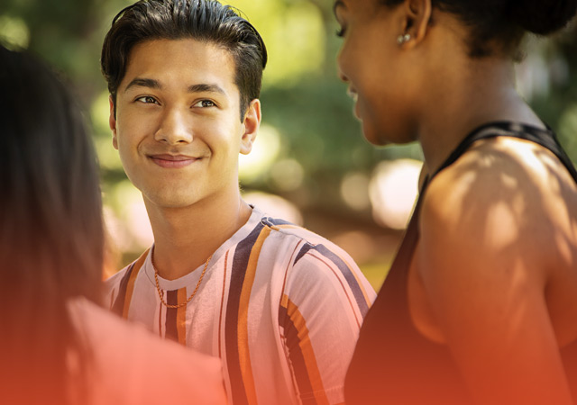 two prospective students talking with one another on a campus tour