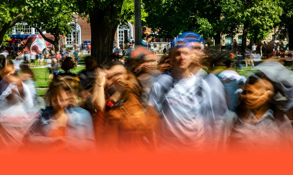 a flurry of activity as students flood the Quad between classes