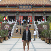 a student outside one of Hong Kong many shrines