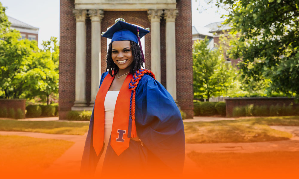 UIUC graduate with the Hallene Gateway fountain