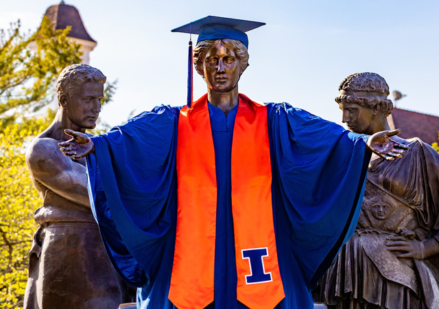 Alma Mater wearing full graduation regalia