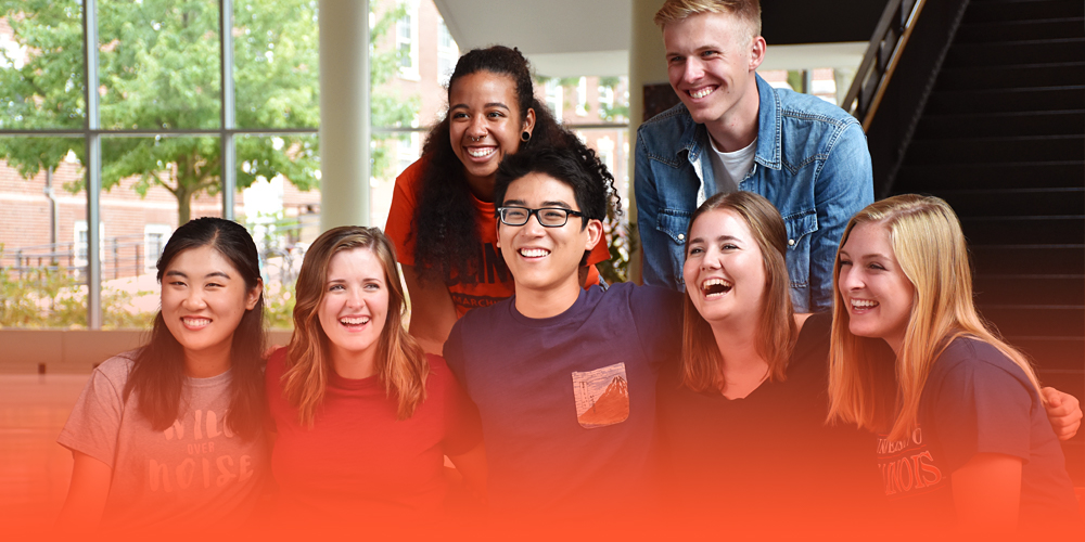 students and residence hall neighbors posing together in Ikenberry Commons